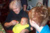 GrandmaFeedingSickErin.jpg (65219 bytes)