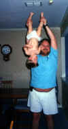JimHolding-BabyRobbie-upsidedown.jpg (71394 bytes)